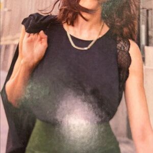 Cabi Veil Top. Chic Black Sleeveless Top with Lace Detail.